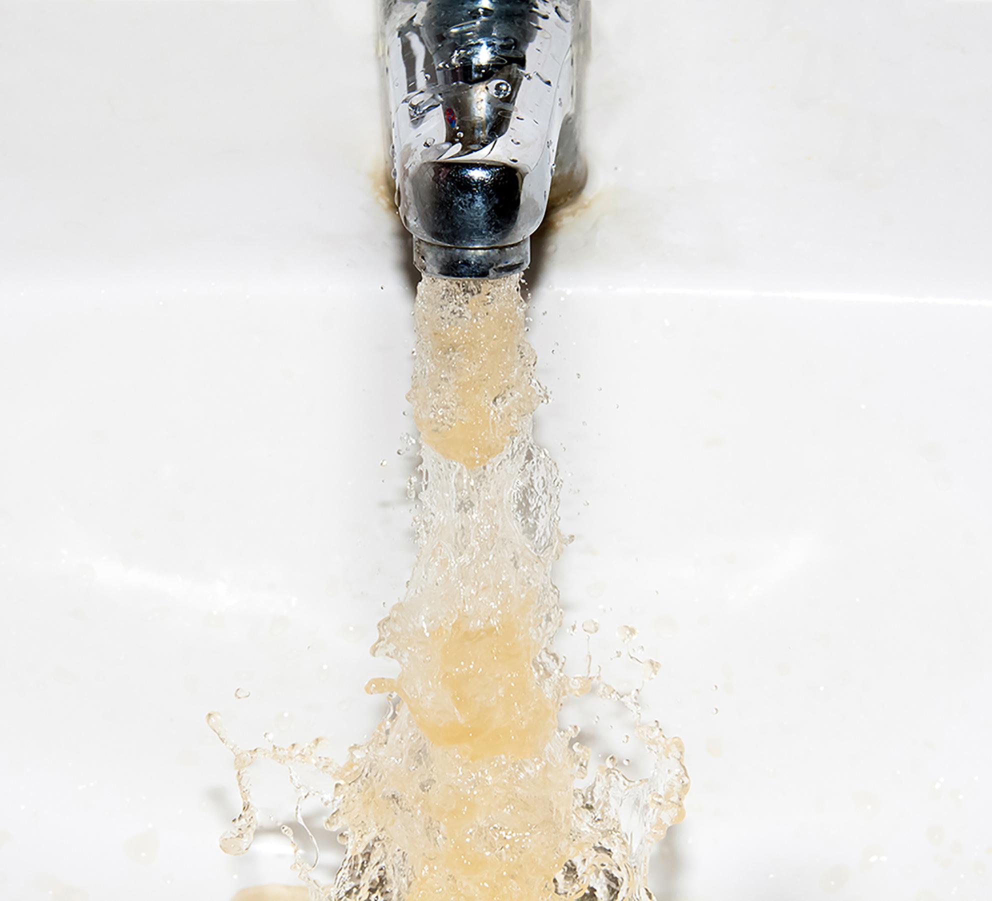 brownish water coming out of a sink tap