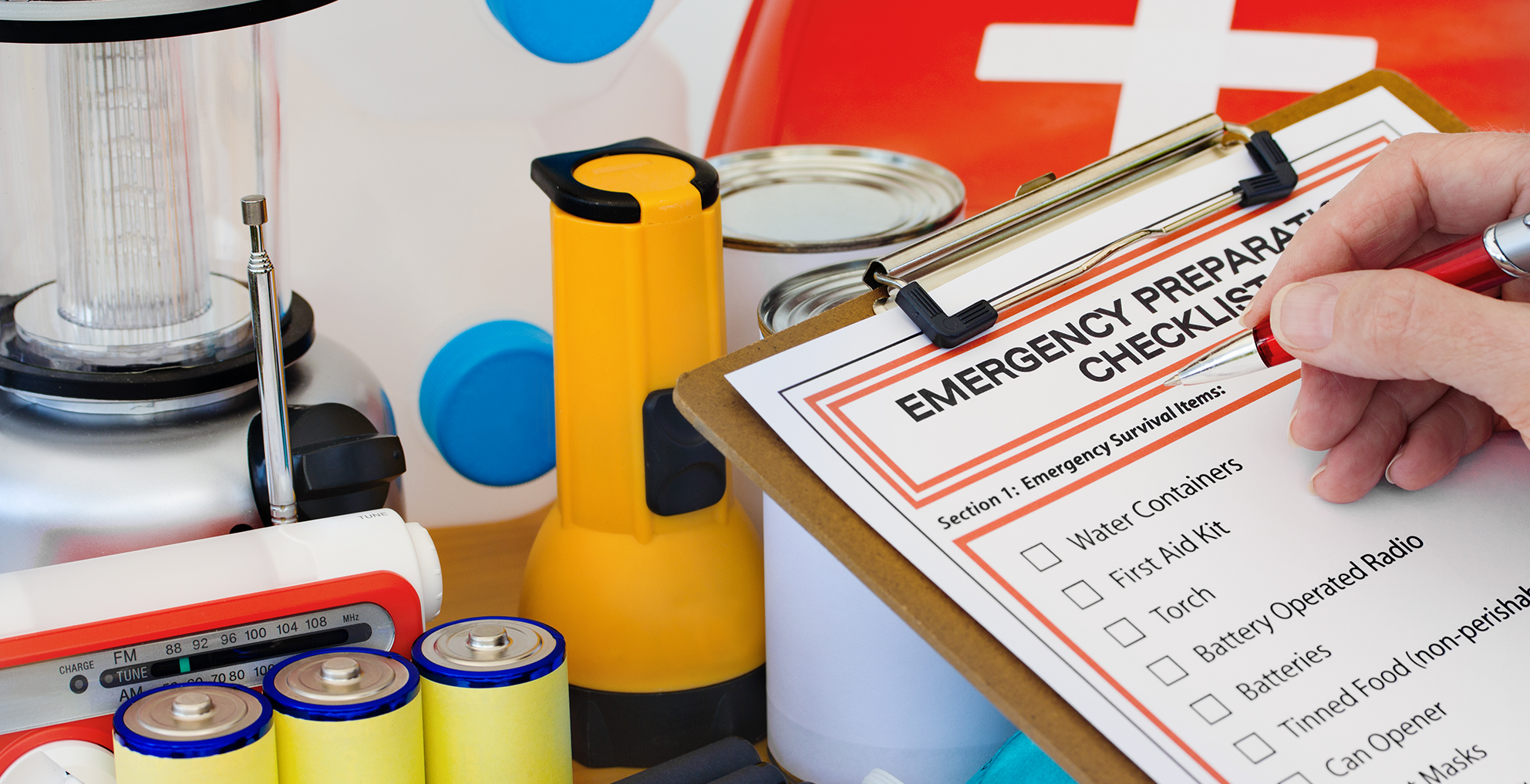 emergency checklist with supplies in the background