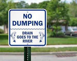 No dumping drain goes to the river sign