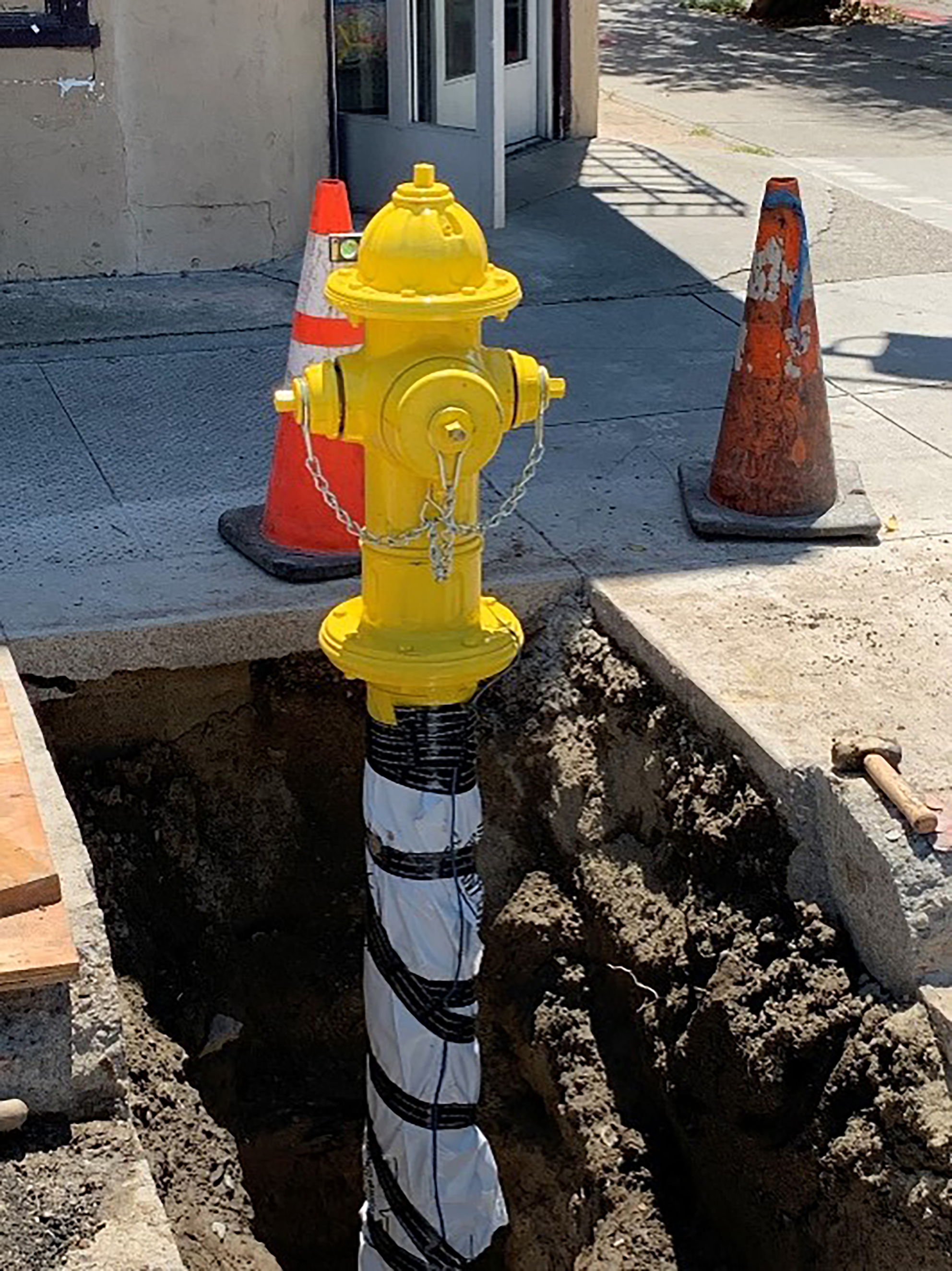 a new hydrant being installed in the ground