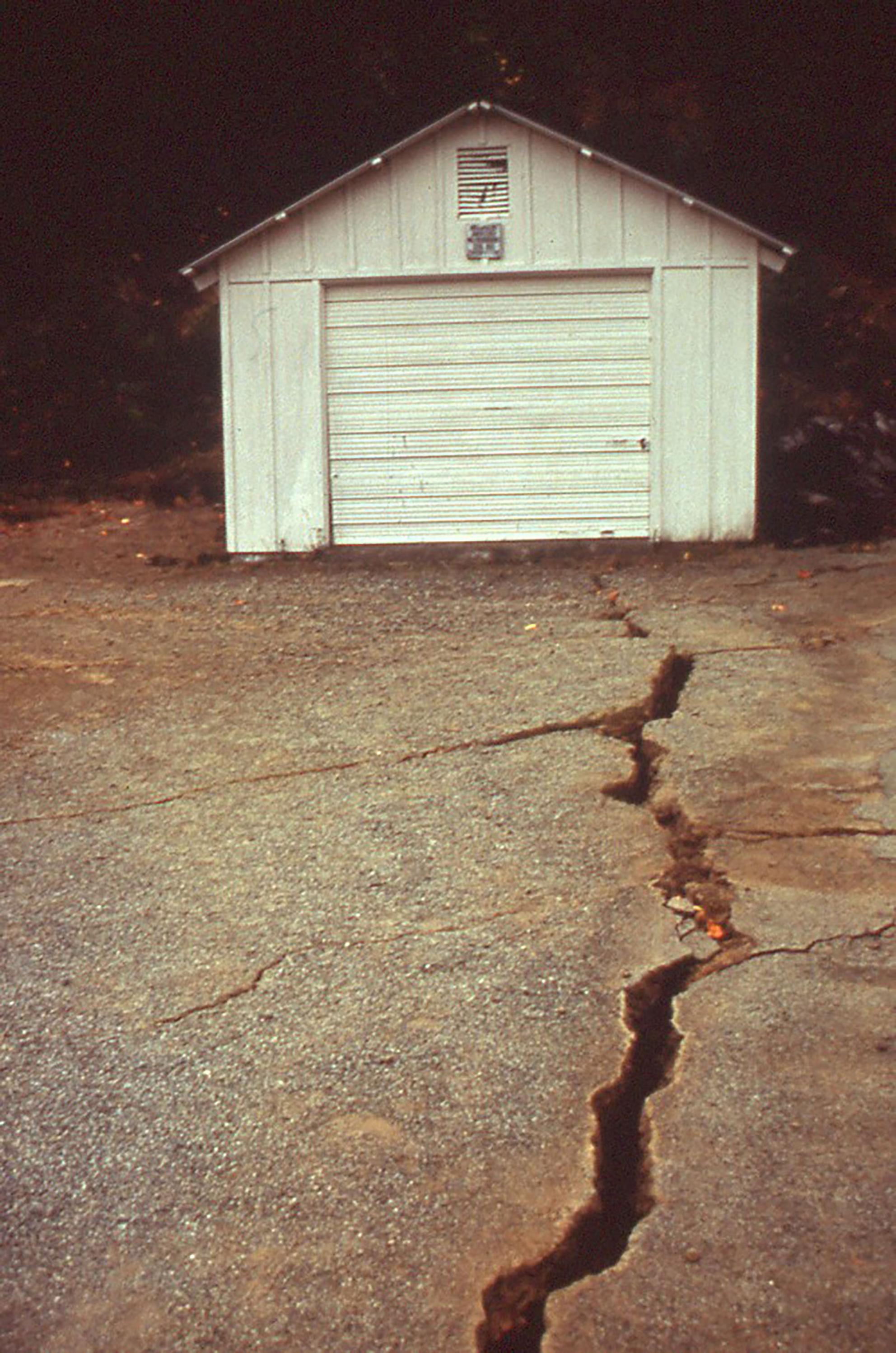 photo of a driveway with a crack from an earthquake 