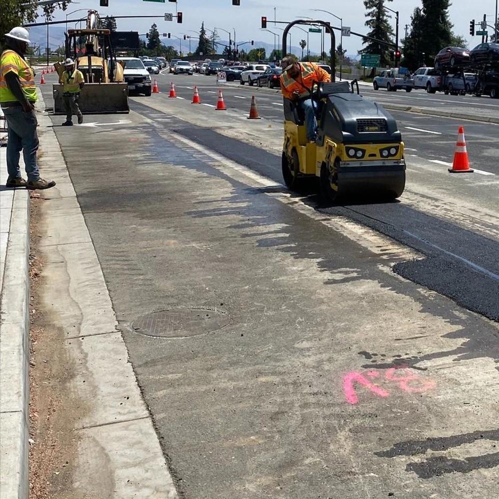 San Jose Water employees paving a trench on Stevens Creek Blvd