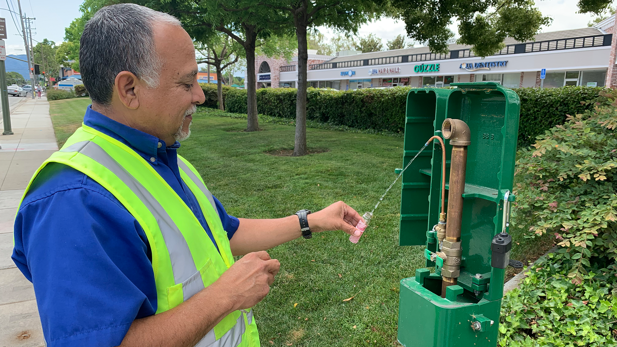 an San Jose Water employee testing water