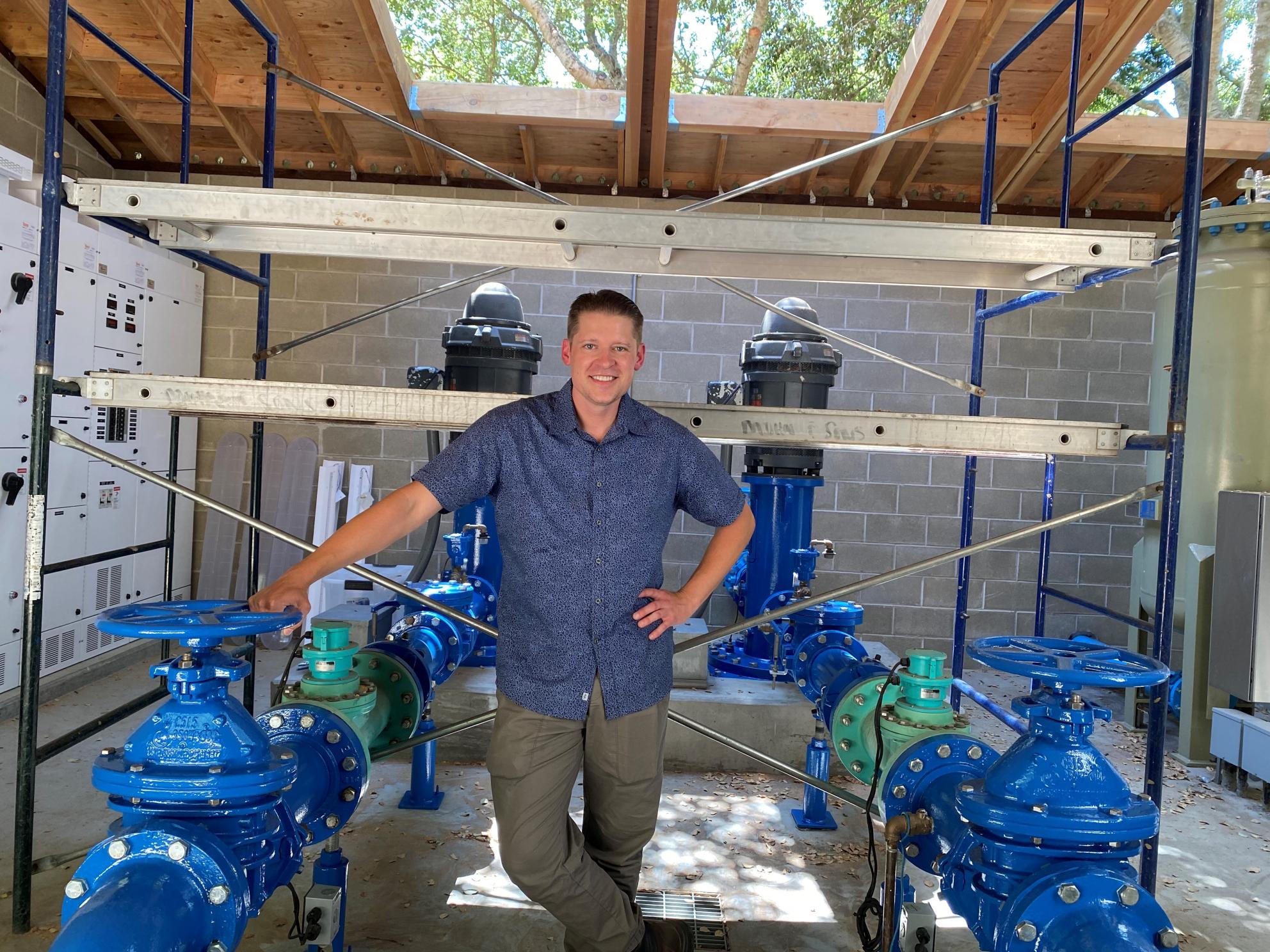 Brandon Stieber in front of water pipes
