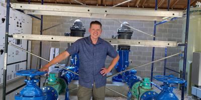 Brandon Stieber in front of water pipes