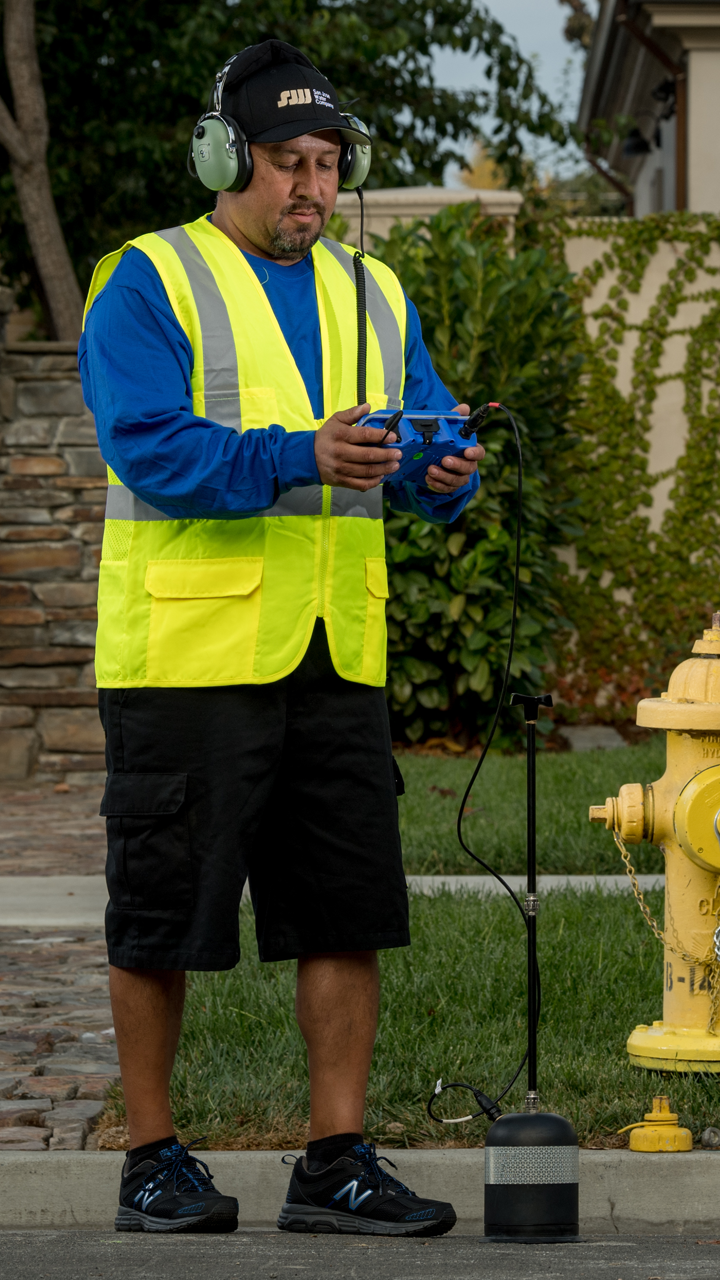 San Jose Water employee using a ground microphone