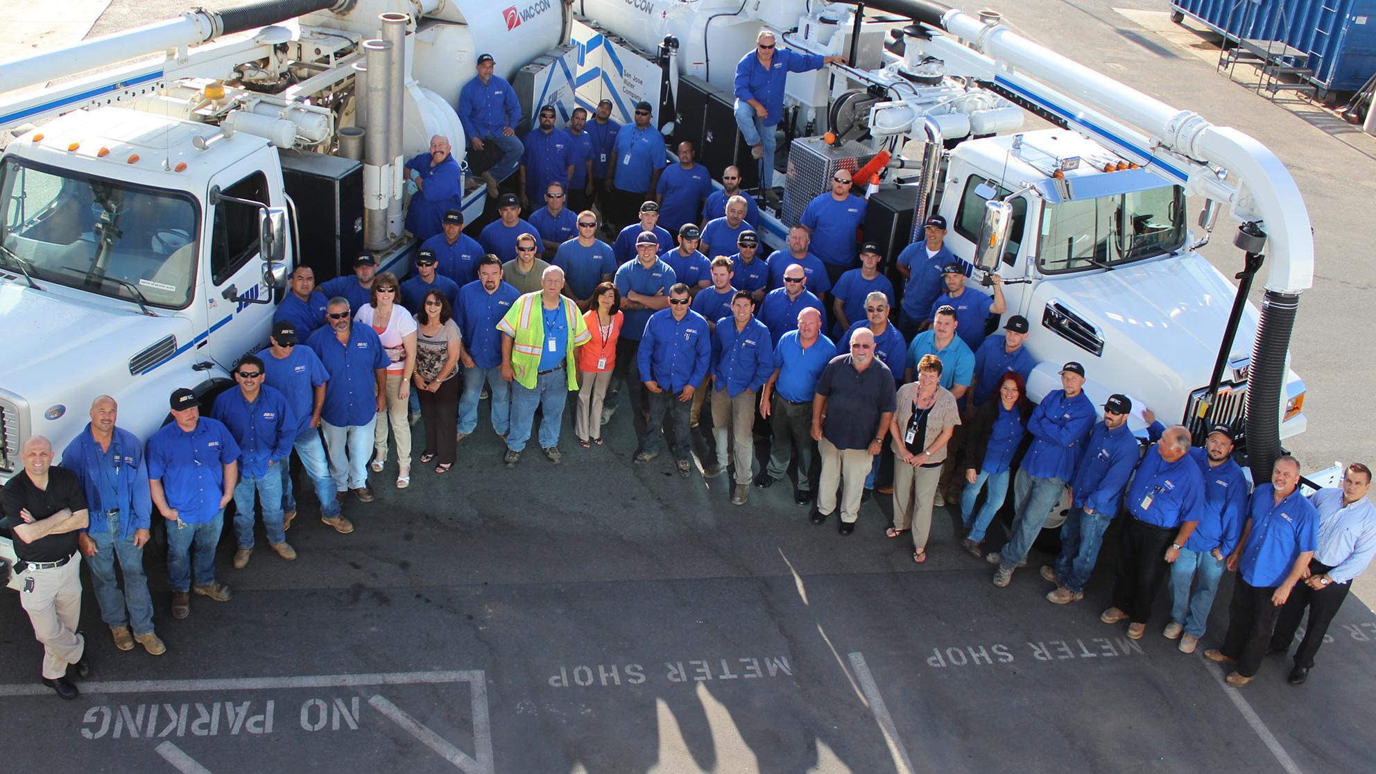 Diverse San Jose Water employees stand outside together