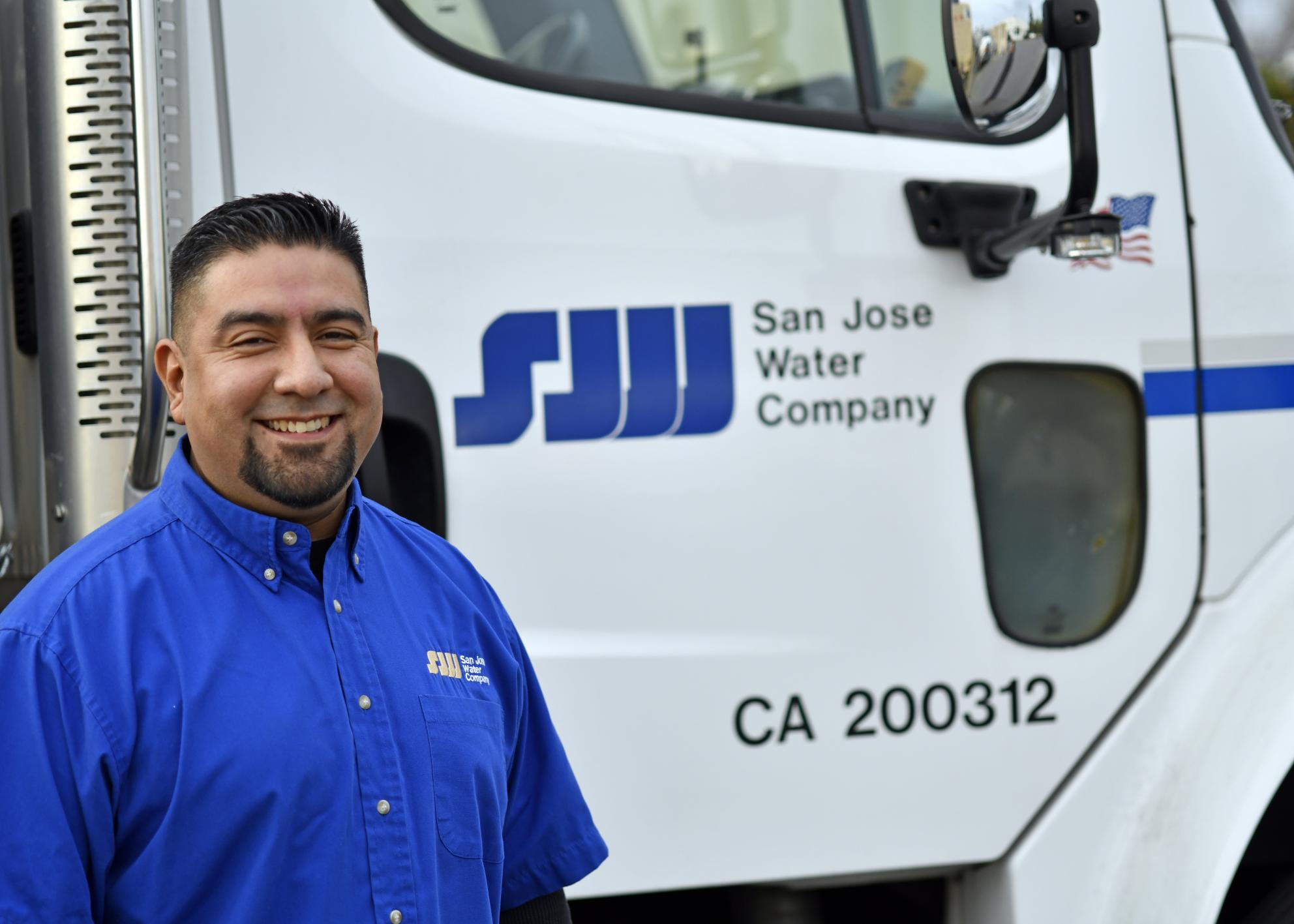 SJW employee in front of SJW truck