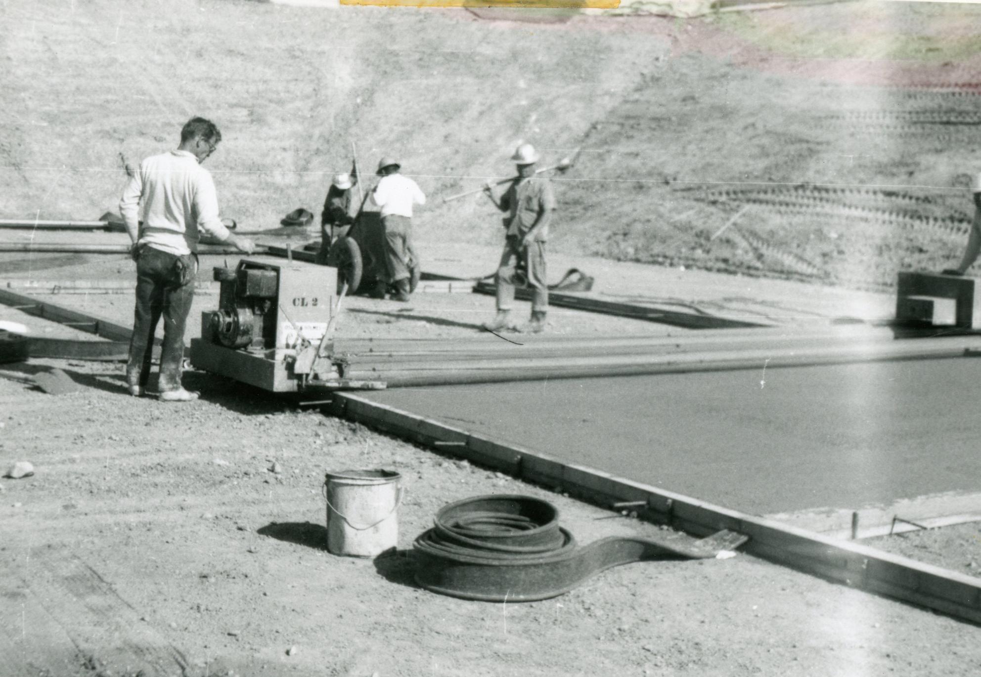 Columbine Historical Image 1 - black and white photo of workers laying cement