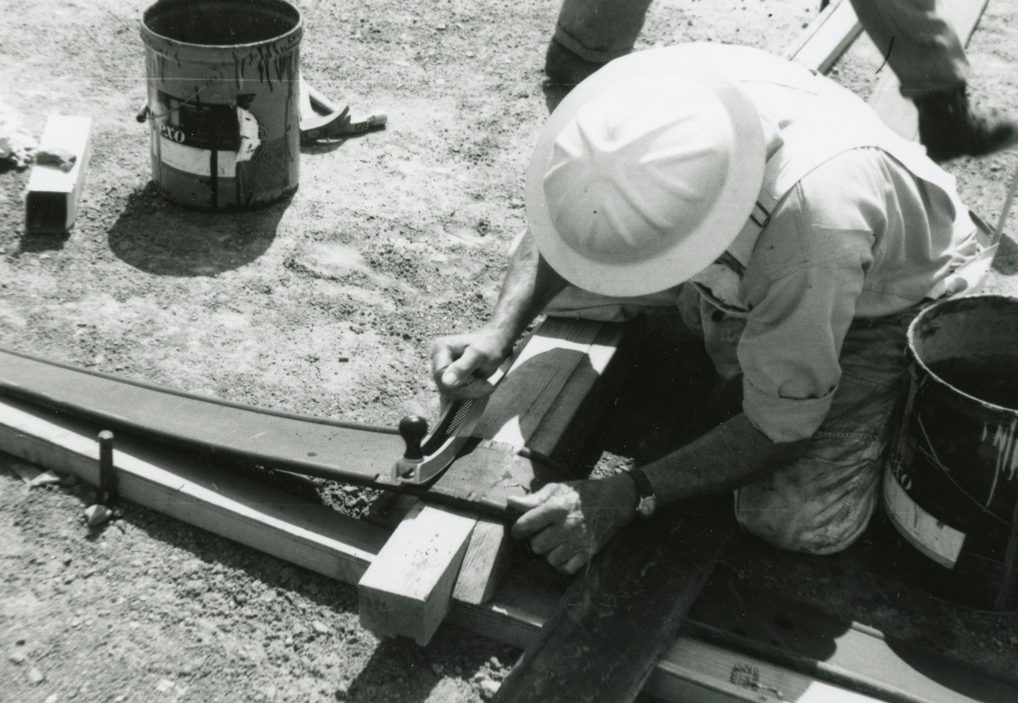 Columbine-page-8111.png Columbine Historical Image 3 - black and white photo of a workers cutting material