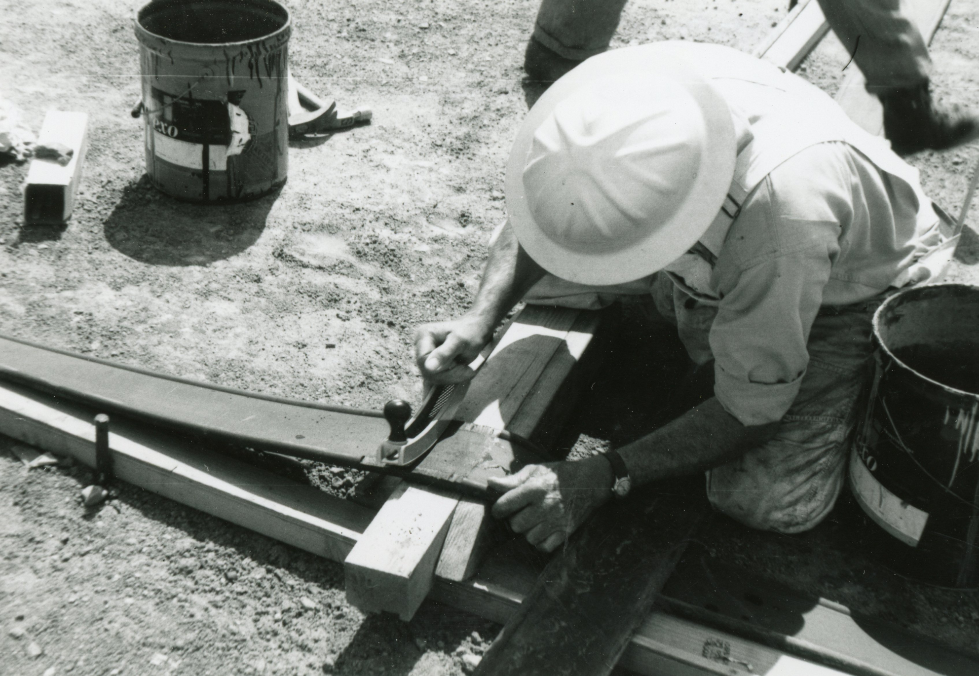 Columbine Historical Image 3 - black and white photo of a workers cutting material