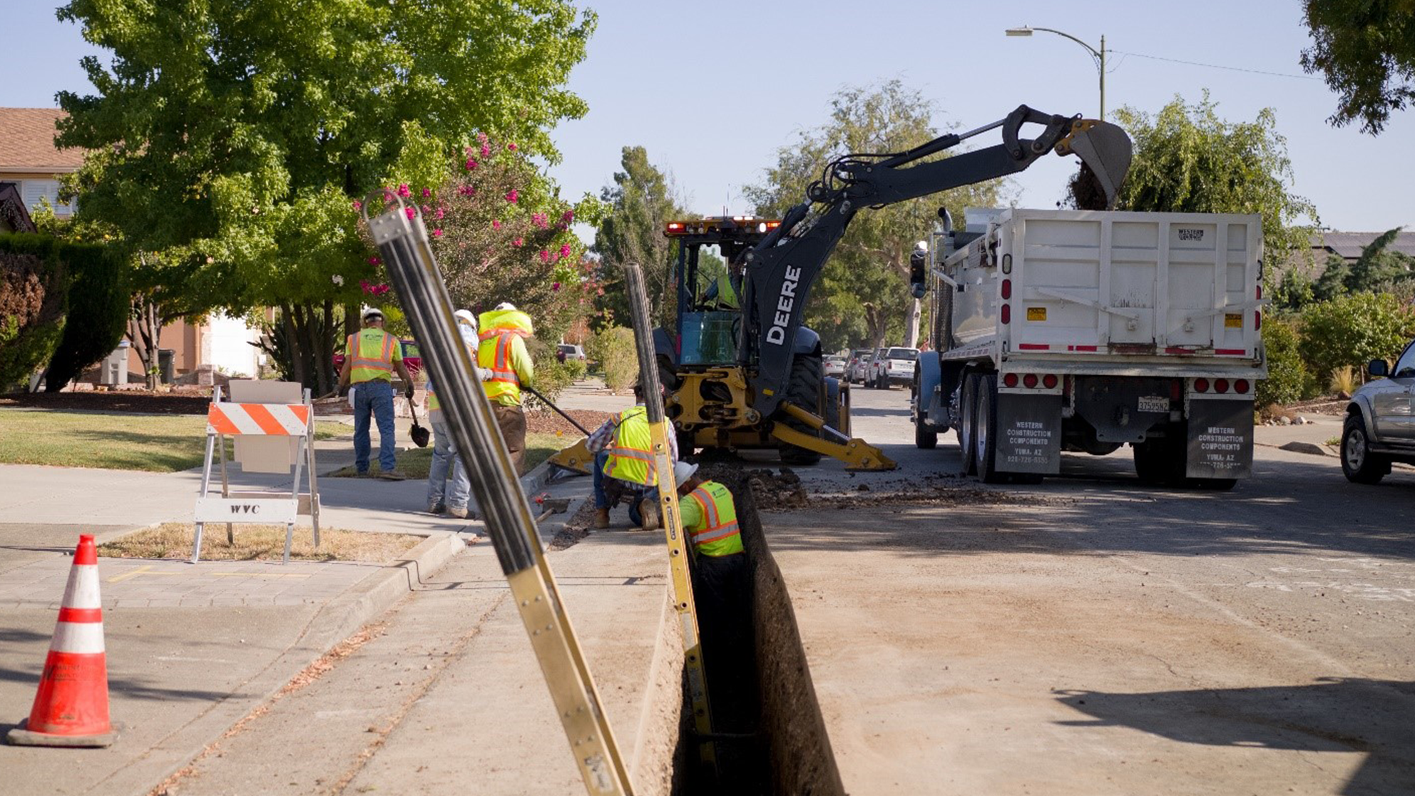 SJW-2020-feature.png SJW workers installing a new residential waterline