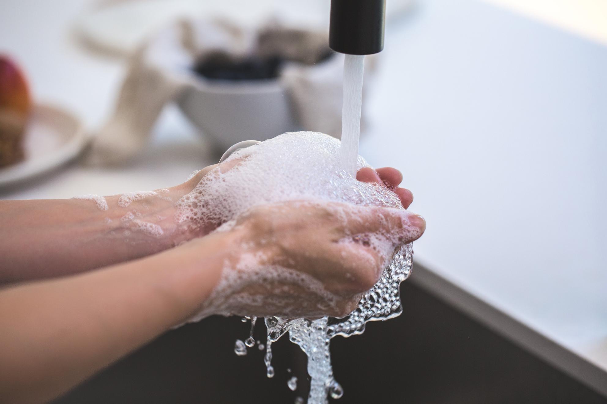 person-washing-his-hand-545014.jpg hands under faucet washing