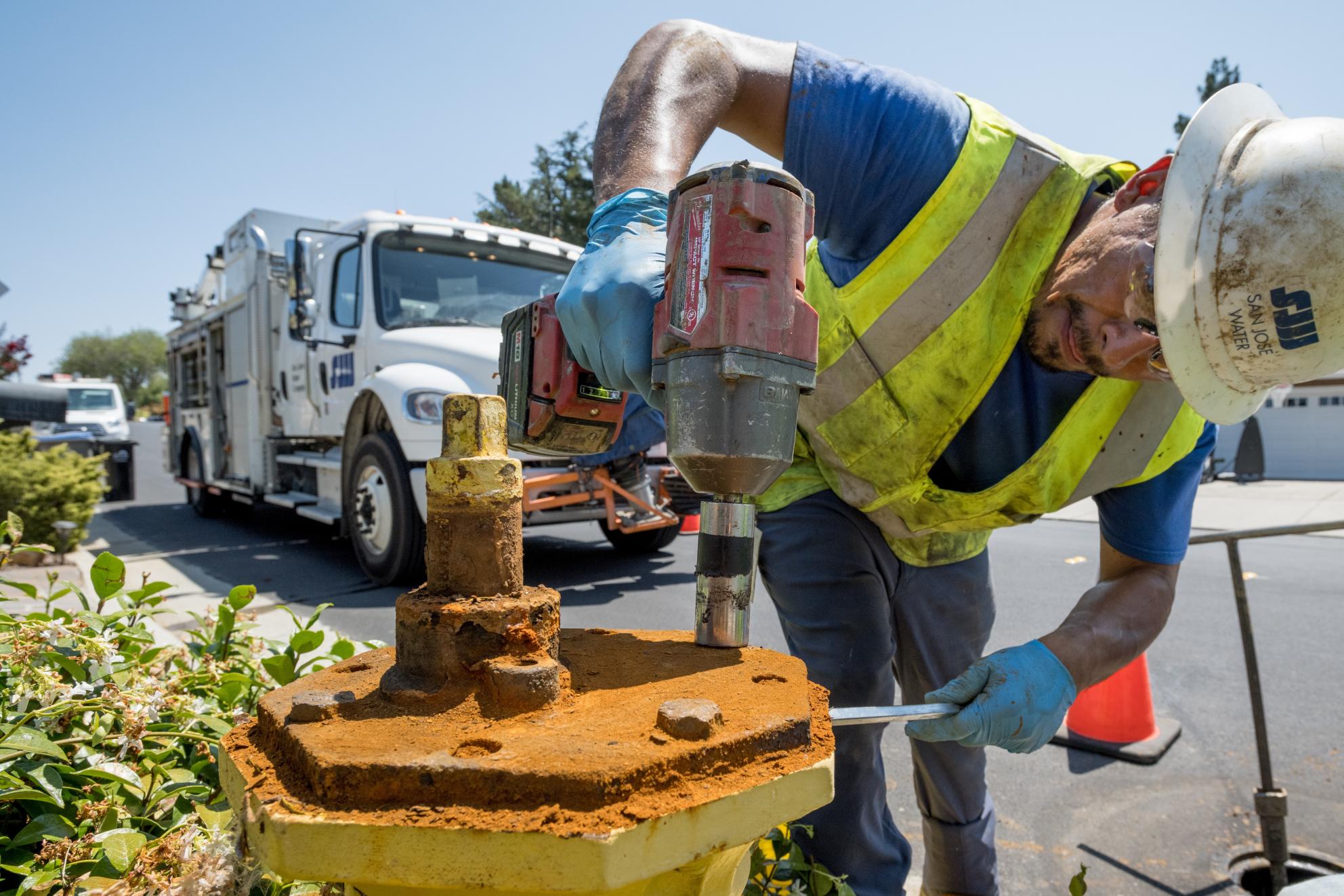 SJW employee fixing fire hydrant
