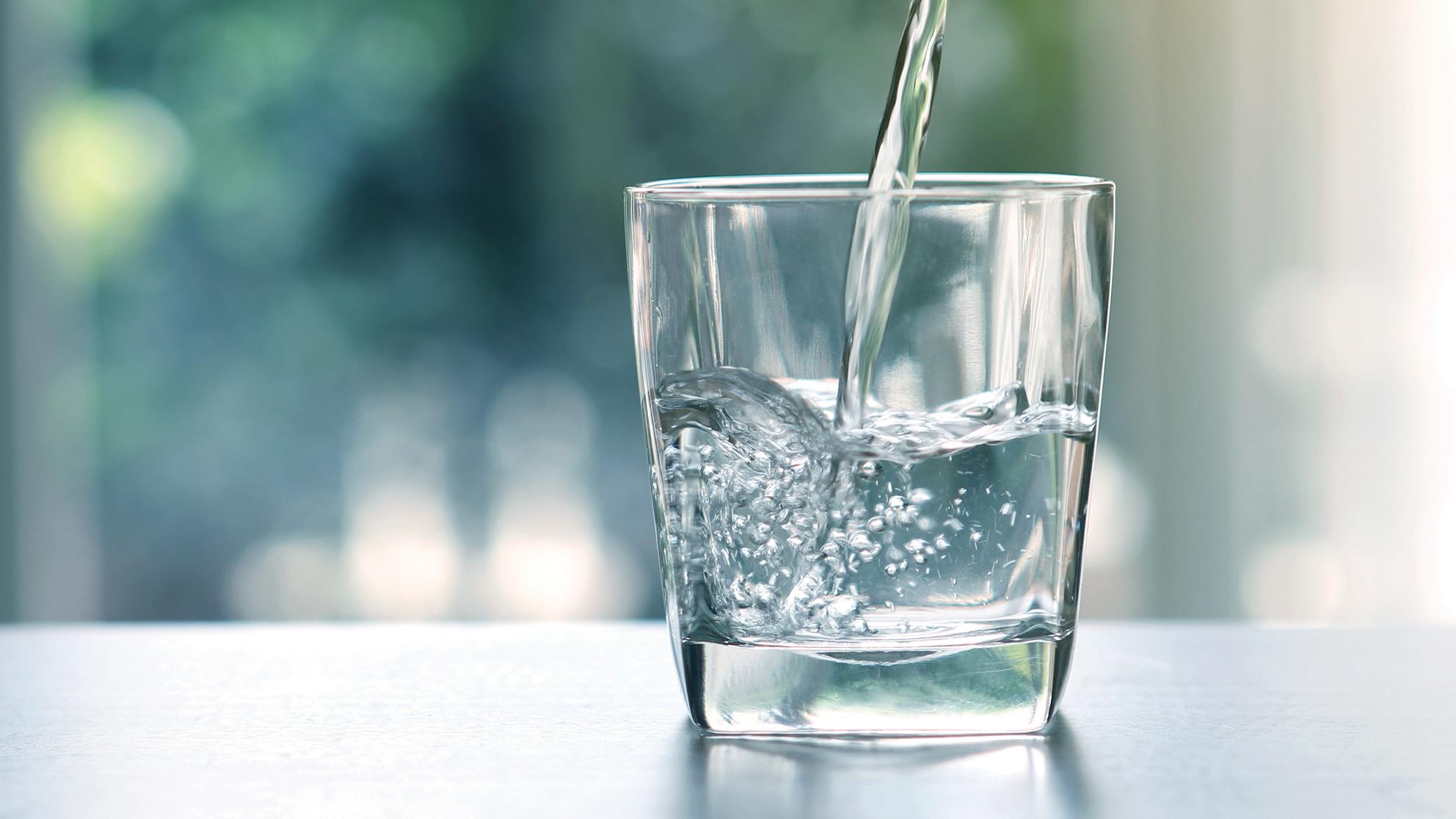 Water pouring into a glass. 