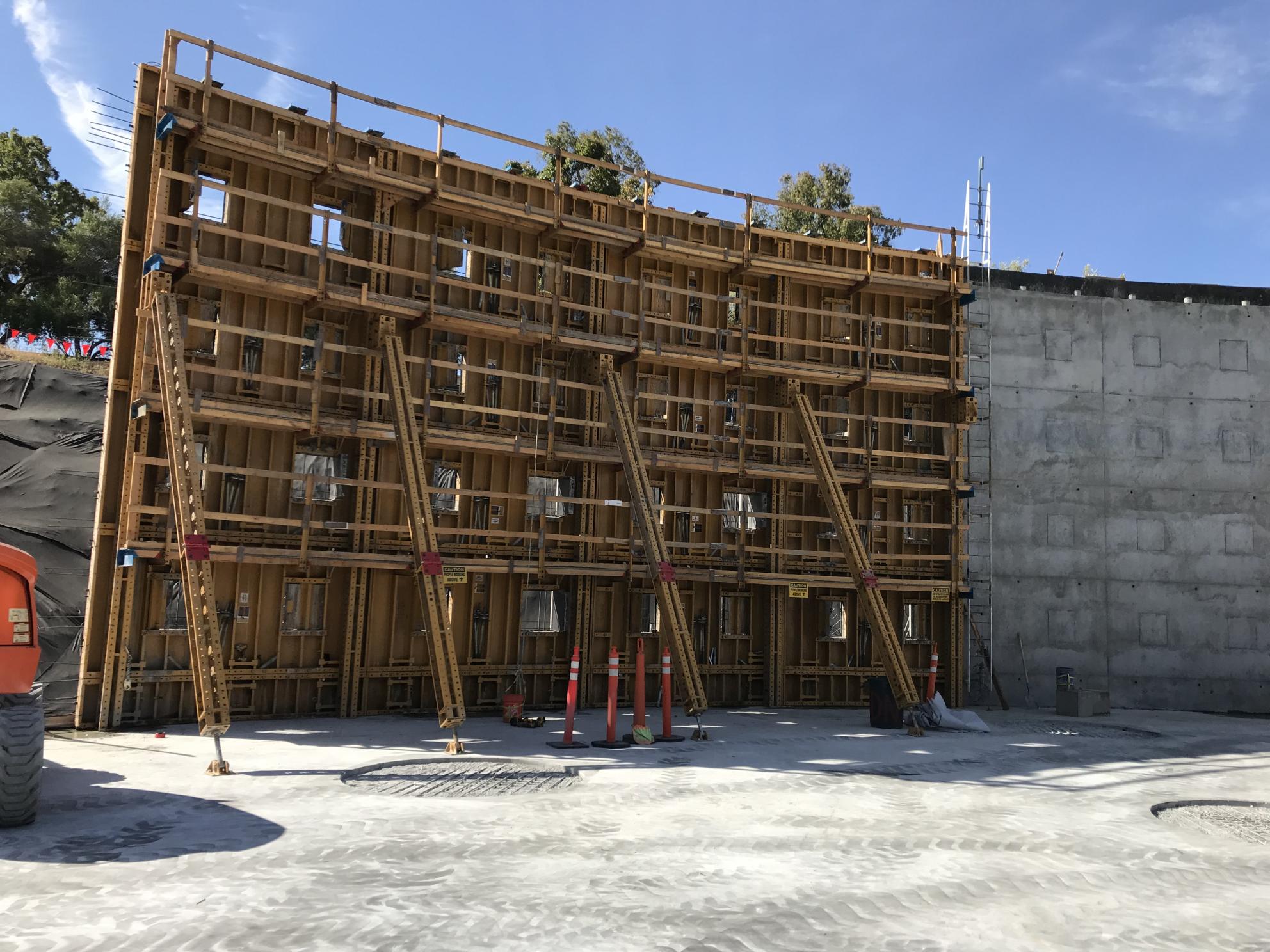 wooden frames of tank walls adjacent to already poured concrete walls