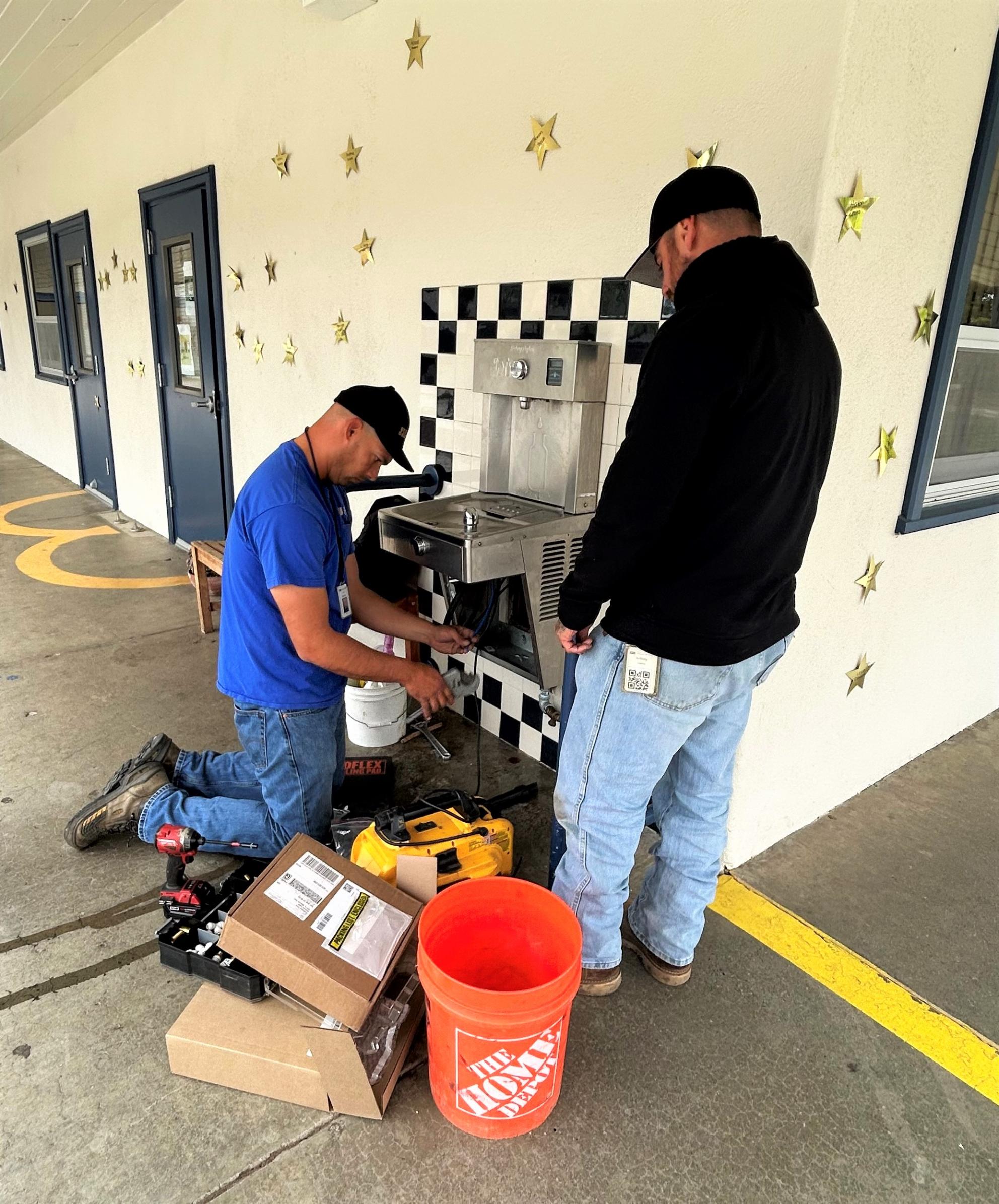 SJW crew installing one of the new filtered fountains