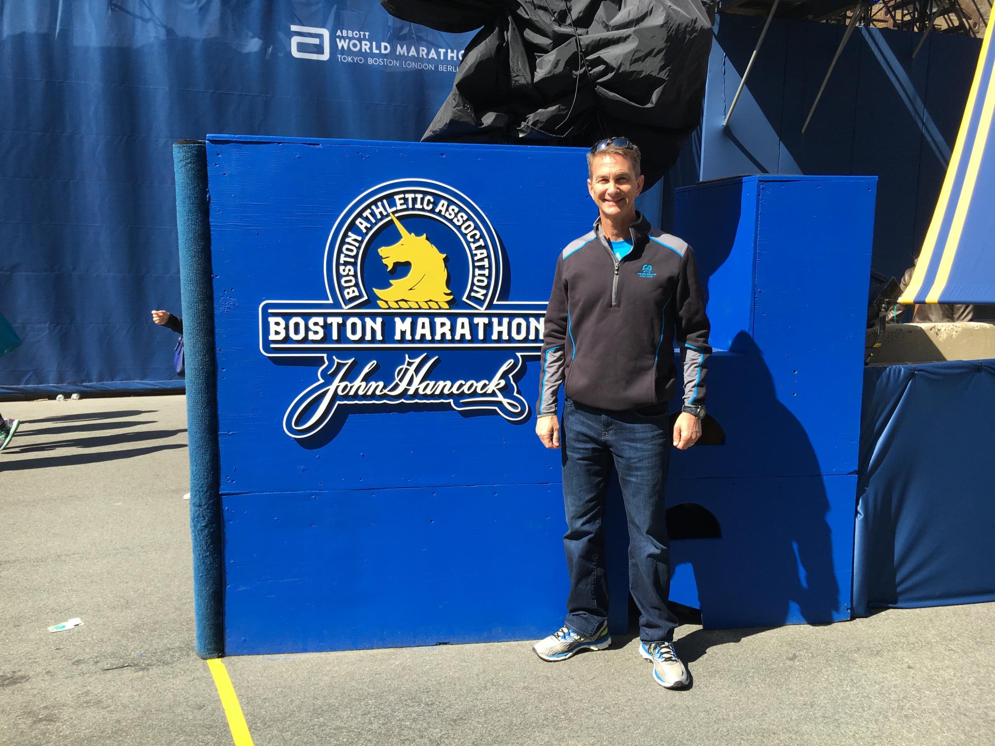 New CEO Eric Thornburg standing outdoors in street clothes at the Boston Marathon