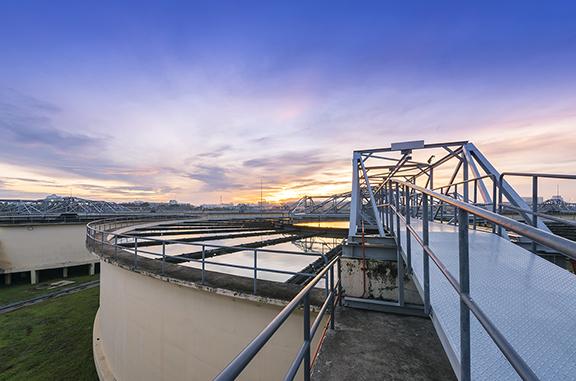 Outdoor shot of a water treatment tank at sunrise